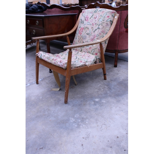 2529 - A RETRO TEAK OPEN FIRESIDE CHAIR WITH SWEPT ARMS