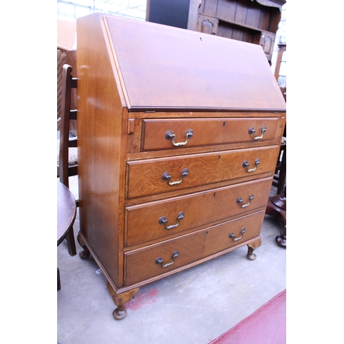 2609 - A MID 20TH CENTURY OAK BUREAU ON CABRIOLE LEGS BEARING NORTHAMPTON CABINET COMPANY, 30