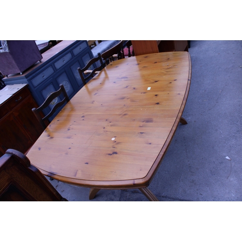 2633 - A PINE TWIN PEDESTAL EXTENDING DINING TABLE