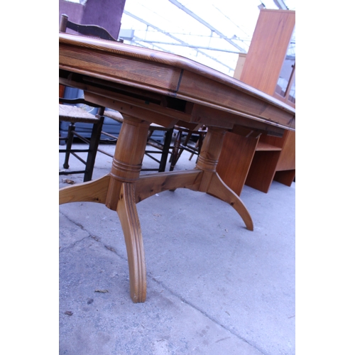 2633 - A PINE TWIN PEDESTAL EXTENDING DINING TABLE