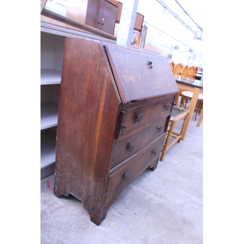 2688 - A MID 20TH CENTURY OAK BUREAU, 34