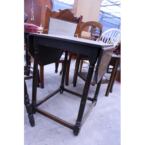 2718 - AN EARLY 20TH CENTURY OAK DROP-LEAF TABLE WITH CANTED CORNERS