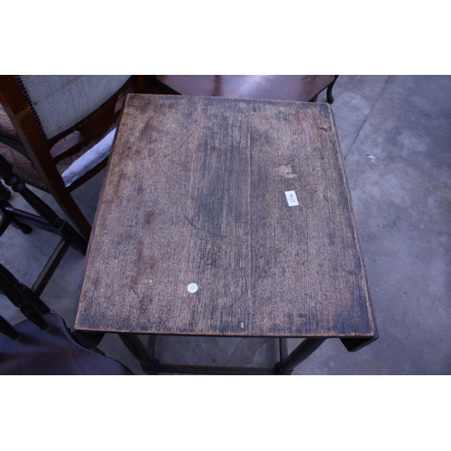 2718 - AN EARLY 20TH CENTURY OAK DROP-LEAF TABLE WITH CANTED CORNERS