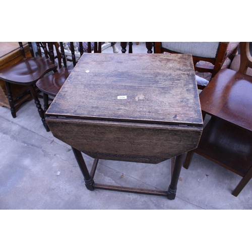 2718 - AN EARLY 20TH CENTURY OAK DROP-LEAF TABLE WITH CANTED CORNERS