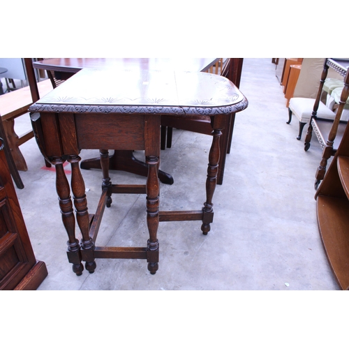 2728 - A SMALL OAK JACOBEAN STYLE GATE-LEG TABLE ON TURNED LEGS WITH CARVED TOP, 36