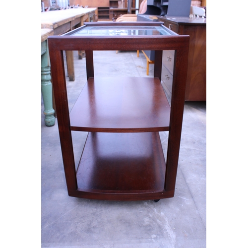 2734 - A MAHOGANY TWO TIER TROLLEY WITH INSET GLASS TOP