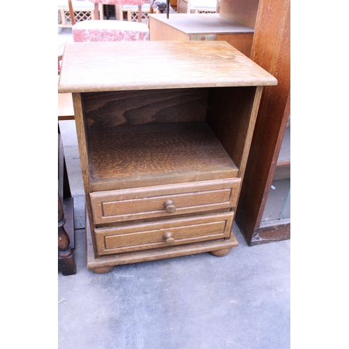 2827 - A MID 20TH CENTURY OAK BOOKCASE WITH GLASS SLIDING DOORS AND AN OAK BEDSIDE TABLE