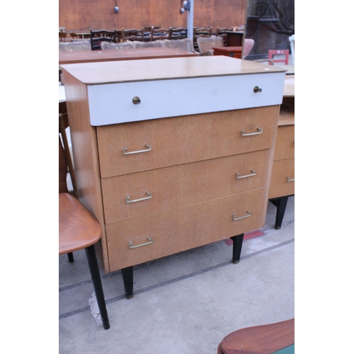 2890 - A RETRO OAK DRESSING TABLE AND MATCHING CHEST OF FOUR DRAWERS ON BLACK PAINTED LEGS