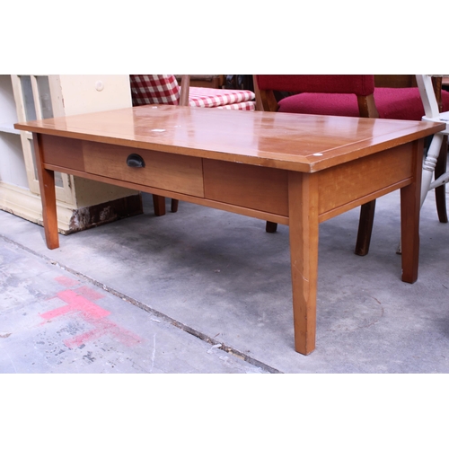 2964 - A HARDWOOD COFFEE TABLE WITH SINGLE PULL TROUGH DRAWER 48