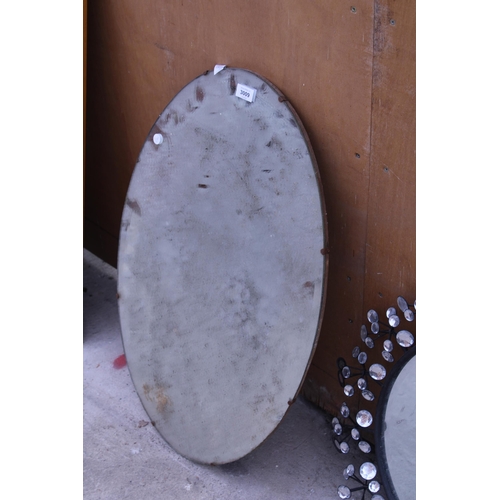 3009 - AN OVAL FRAMELESS WALL MIRROR AND 22