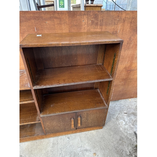 3020 - A RANGE OF THREE MID 20TH CENTURY OAK STORAGE SHELVES ENCLOSING CUPBOARDS, TWO SECTIONS BEING 40.5