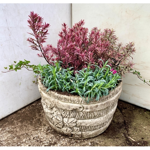 26 - ONE ORNAMENTAL CONCRETE PLANTER FILLED WITH MIXED PINK COLOURED HEBES, AND DIANTHUS. APPROX 40CM DIA... 