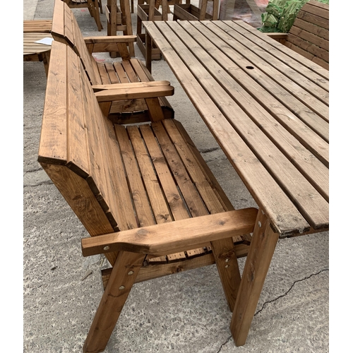 246 - AN EX DISPLAY CHARLES TAYLOR GARDEN FURNITURE SET. ONE VERY LARGE TABLE WITH FOUR DOUBLE SEATER BENC... 