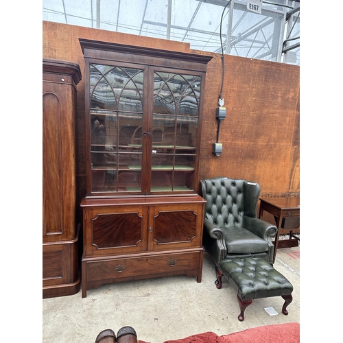 2526 - A VICTORIAN MAHOGANY TWO DOOR GLAZED BOOKCASE WITH CUPBOARD AND DRAWER TO BASE, 47