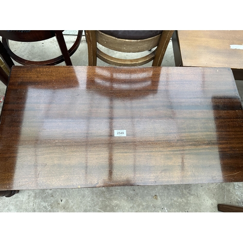 2549 - A MAHOGANY TWIN-PEDESTAL DROP-LEAF COFFEE TABLE