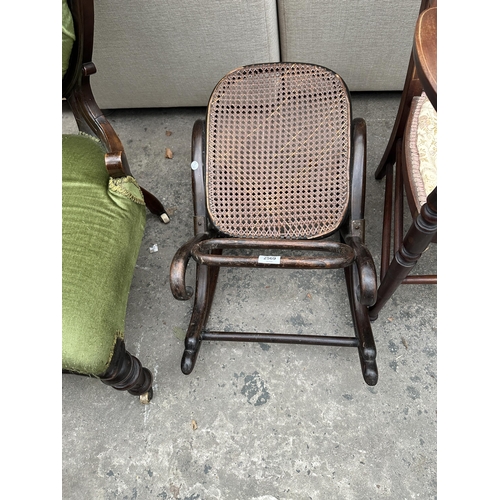 2569 - A THONET STYLE BENTWOOD AND CANE ROCKING FOOT REST