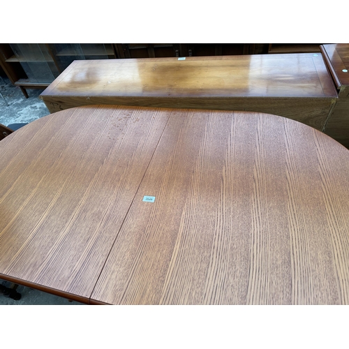 2649 - AN EXTENDING BERKLEY TEAK DINING TABLE, 58