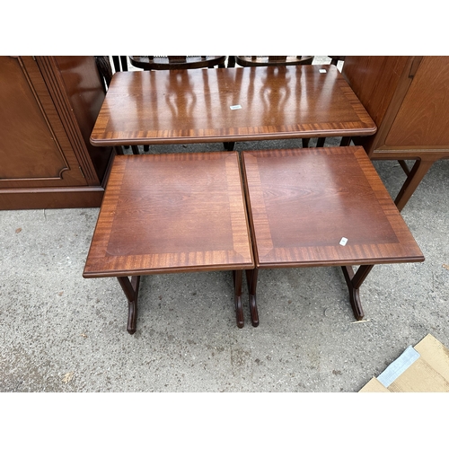 2657 - A MAHOGANY AND CROSSBANDED NEST OF THREE TABLES