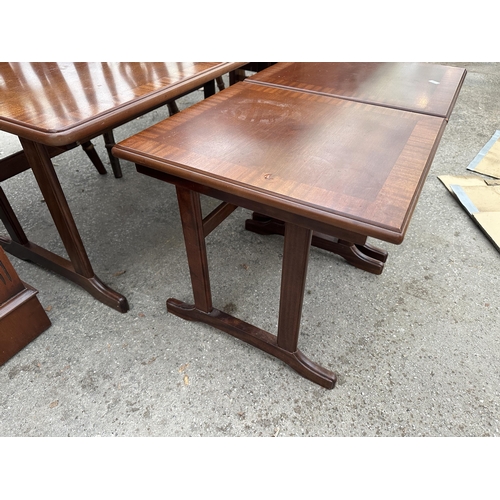 2657 - A MAHOGANY AND CROSSBANDED NEST OF THREE TABLES