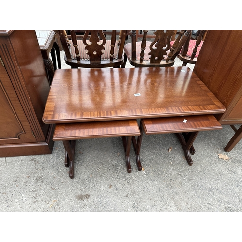 2657 - A MAHOGANY AND CROSSBANDED NEST OF THREE TABLES