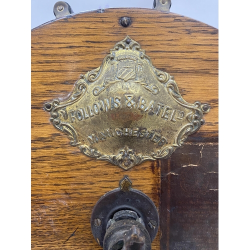 18 - AN ANTIQUE KNIFE SHARPENER BY FOLLOWS AND BATE LTD WITH AN OAK CASE, CAST IRON STAND AND CRANK