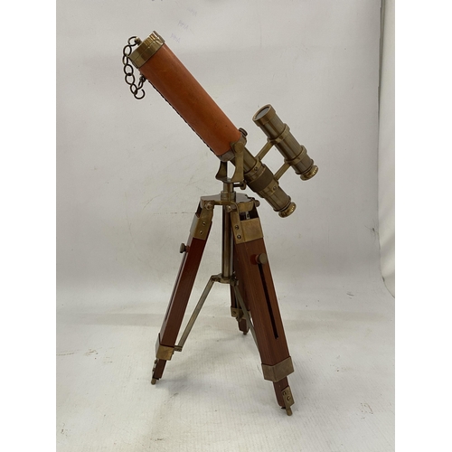 19 - A BRASS AND LEATHER TELESCOPE ON A WOODEN STAND