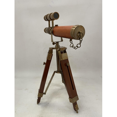 19 - A BRASS AND LEATHER TELESCOPE ON A WOODEN STAND