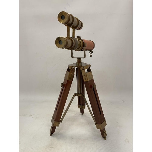 19 - A BRASS AND LEATHER TELESCOPE ON A WOODEN STAND