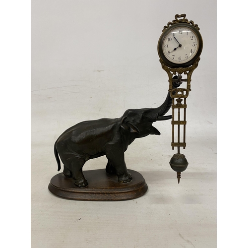 2 - AN ANTIQUE ELEPHANT MYSTERY CLOCK BELIEVED TO BE JUNGHANS GERMANY WITH A DECORATIVE GRIDIRON PENDULU... 