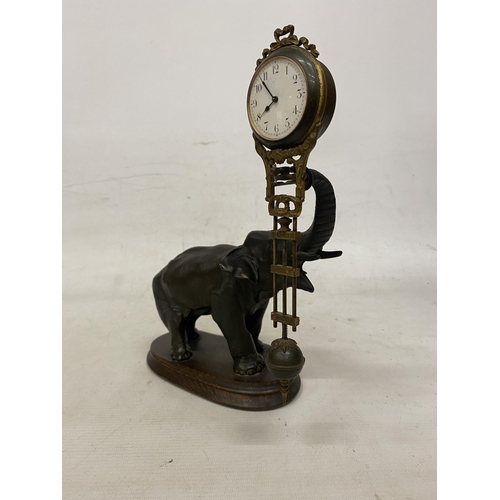 2 - AN ANTIQUE ELEPHANT MYSTERY CLOCK BELIEVED TO BE JUNGHANS GERMANY WITH A DECORATIVE GRIDIRON PENDULU... 