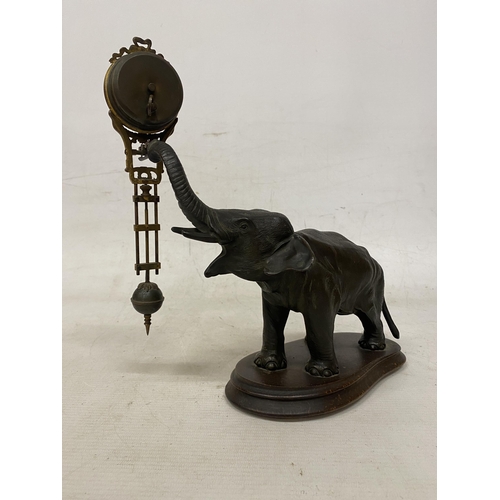 2 - AN ANTIQUE ELEPHANT MYSTERY CLOCK BELIEVED TO BE JUNGHANS GERMANY WITH A DECORATIVE GRIDIRON PENDULU... 