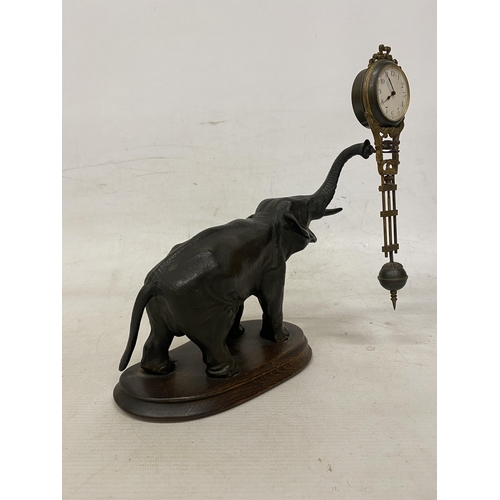 2 - AN ANTIQUE ELEPHANT MYSTERY CLOCK BELIEVED TO BE JUNGHANS GERMANY WITH A DECORATIVE GRIDIRON PENDULU... 