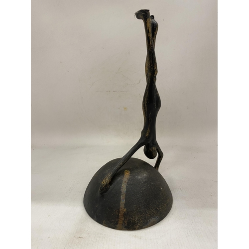 28 - A VINTAGE CAST IRON PAL-BELL DANCER SCULPTURE