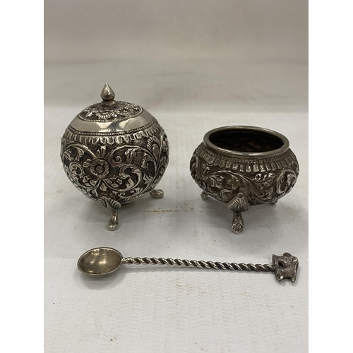 29 - A DECORATIVE FOUR PIECE INDIAN SILVER CRUET SET