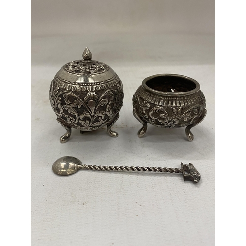 29 - A DECORATIVE FOUR PIECE INDIAN SILVER CRUET SET