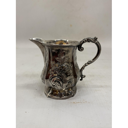 4 - TWO ITEMS OF HALLMARKED SILVER TO INCLUDE A SMALL BON BON DISH AND REPOUSSE FLORAL DESIGN JUG - GROS... 