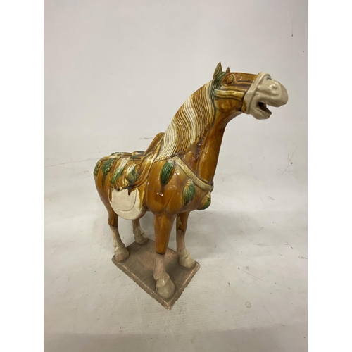 42 - A PAIR OF TANG DYNASTY DRIP GLAZE WAR HORSES - 39.5 X 38.5 CM