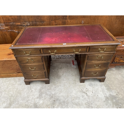 2513 - AN EDWARDIAN STYLE TWIN-PEDESTAL DESK ENCLOSING EIGHT DRAWERS WITH INSET LEATHER TOP, 54