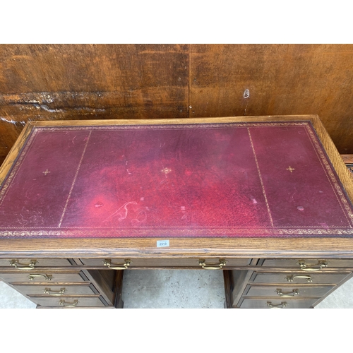 2513 - AN EDWARDIAN STYLE TWIN-PEDESTAL DESK ENCLOSING EIGHT DRAWERS WITH INSET LEATHER TOP, 54