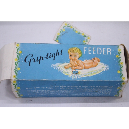 101 - A VINTAGE BOXED, GRIP TIGHT, BANANA BOTTLE BABY FEEDER