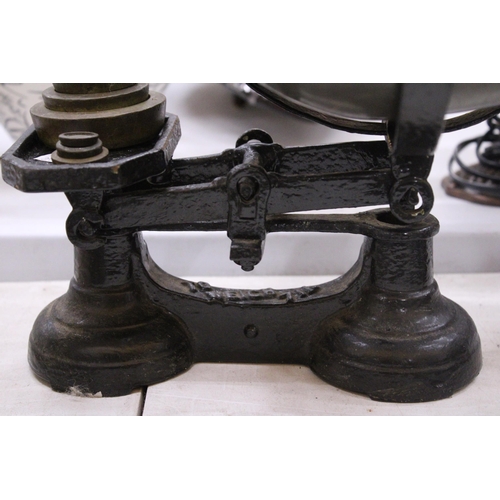 107 - A SET OF CAST SCALES WITH PAN AND WEIGHTS