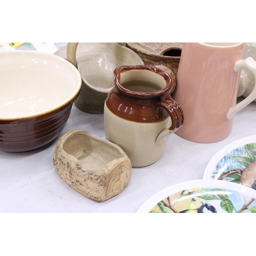 125 - A QUANTITY OF STONEWARE TO INCLUDE JARS, A HOT WATER BOTTLE, CASSEROLE DISH, JUGS, ETC