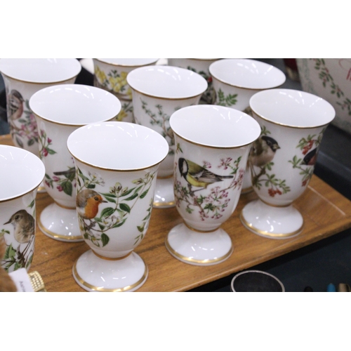 138 - A SET OF TWELVE BIRD THEMED CERAMIC BEAKERS ON A TEAK TRAY