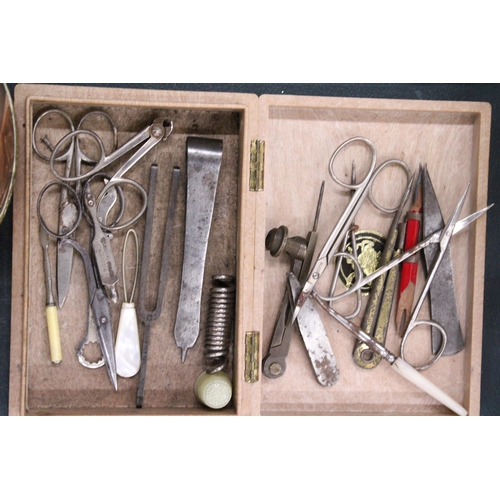 143 - A WOODEN CIGAR BOX CONTAINING VINTAGE SCISSORS, COMPASSES, MANICURE ITEMS, ETC