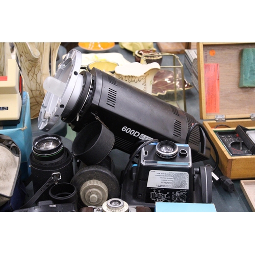 145 - A LARGE LOT OF VINTAGE CAMERAS AND LENSES