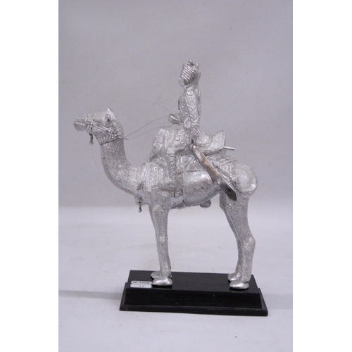 179 - A WHITE METAL ROYAL INDIAN RIDER ON A CAMEL SCULPTURE