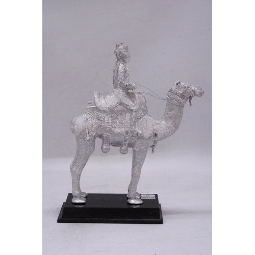 179 - A WHITE METAL ROYAL INDIAN RIDER ON A CAMEL SCULPTURE