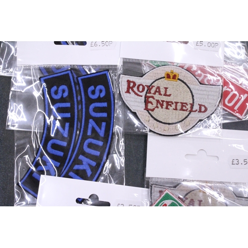 197 - TWENTY SEW ON MOTORING THEMED BADGES TO INCLUDE CASTROL, SUZUKI AND ROYAL ENFIELD - ALL AS NEW IN PA... 