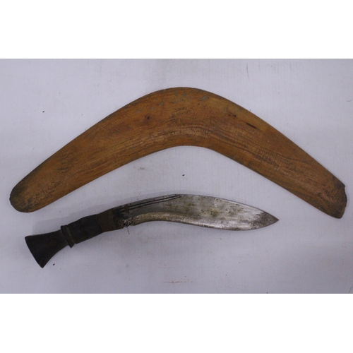 218 - A VINTAGE GURKHA KUKRI KNIFE AND A BOOMERANG