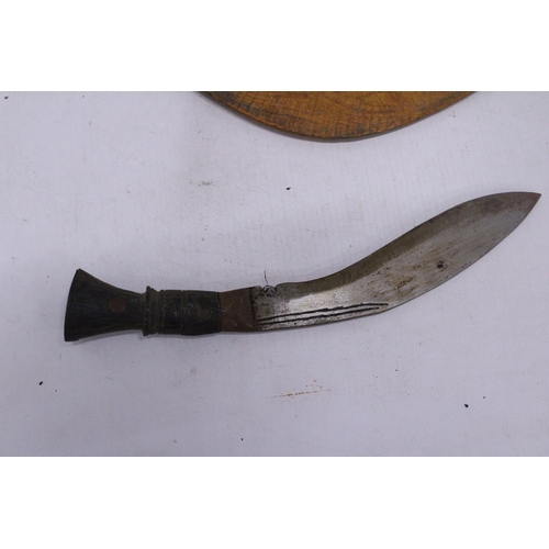 218 - A VINTAGE GURKHA KUKRI KNIFE AND A BOOMERANG